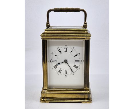 A late 19th/early 20th century Henry Jacot (Paris) French brass carriage clock, gong strike, having white enamel Roman numera