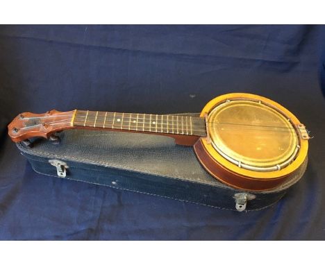 A Keech four-string banjolele banjo, PAT: 219720/24, B7096, in fitted leather case.&nbsp;
