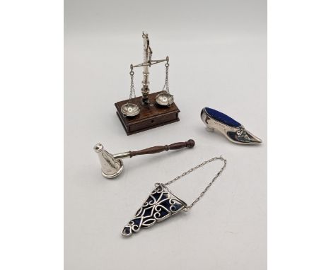 Silver collectables to include a pair of silver balance scales, a candle snuffer, stick pin cushion fashioned as a ladies sho