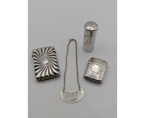 Silver collectables to include two vesta cases, a cheroot case and decanter label 'Whiskey', total weight 62.4gLocation:If th
