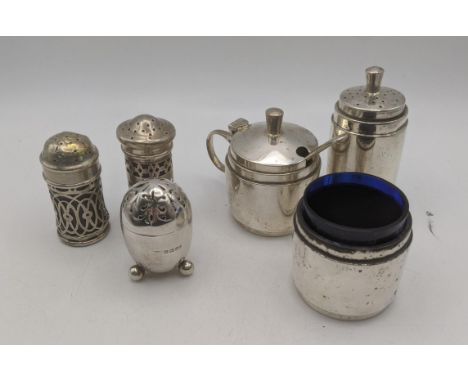 Silver condiment pots to include four pepper pots, a mustard pot and salts, total weight excluding inner liners 240.8gLocatio