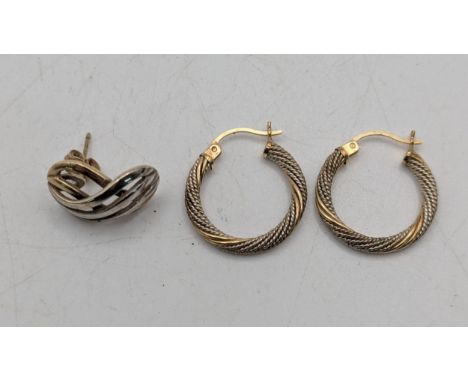 A pair of 14ct yellow gold and silver textured hoop earrings, 1.7g, together with a two tone 9ct gold stud earring, 1.9gLocat