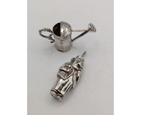 Two silver collectables to include a Scottish sterling silver baby rattle circa 1929 by W H Collins and Co together with a mi