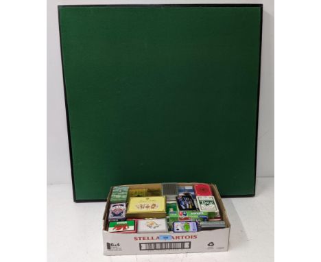 An ebonized folding card table, and over sixty packs of cards.Location:If there is no condition report shown, please request