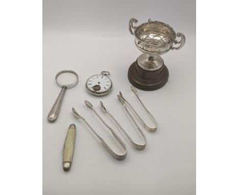 A mixed lot of silver and collectables to include three sugar tongs, an open faced silver cased pocket knife, total weight ex