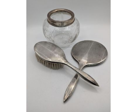 Silver to include a dressing table brush and mirror, along with a silver rimmed crystal cut glass pot Location:If there is no