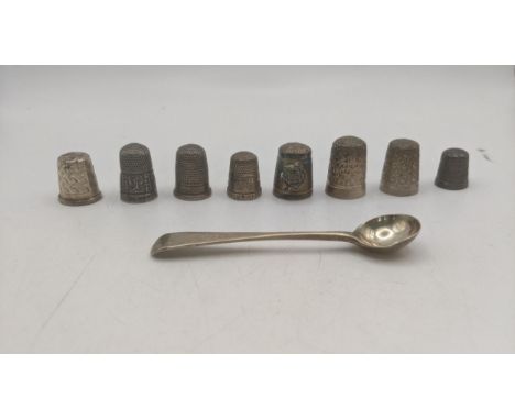 A group of silver thimbles to include examples with floral engraved decoration along with a silver condiment spoon, total wei
