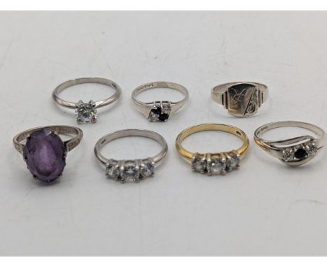 A group of silver rings along with a white metal signet ring, silver gilt ring set with three paste stones, sterling silver a