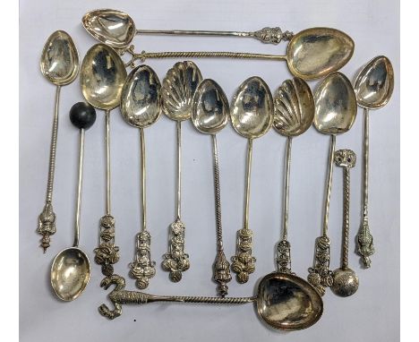 A selection of white metal spoons to include Thai examples with figural terminals 143.4gLocation:If there is no condition rep