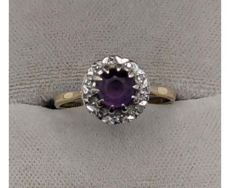 An 18ct yellow and white gold amethyst and diamond halo ring size N, 3.2g Location:If there is no condition report shown, ple