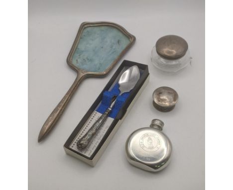A group of silver items to include a dressing table mirror with blue enamel, a silver pot, a silver handled tea spoon and a s