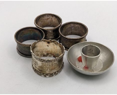 A group of four silver napkin rings 91.9g, with a pewter candleholder Location:If there is no condition report shown, please 