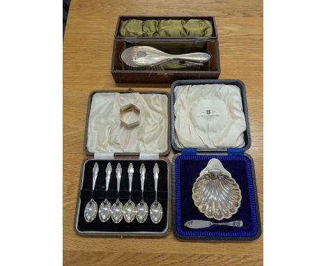Silver to include a set of six teaspoons, a napkin ring and a child's brush and comb, together with a silver butter dish and 