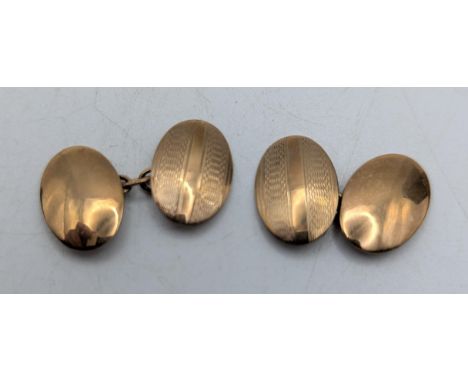 A pair of 9ct yellow gold oval shaped gents cufflinks with engine turned design, 4gLocation:If there is no condition report, 