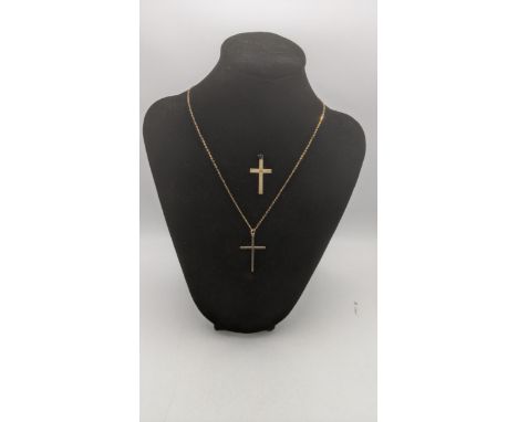 Two 9ct yellow gold crucifix pendants, one of a 9ct yellow gold necklace, total weight 3.8gLocation:If there is no condition 