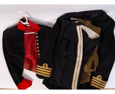 A collection of vintage 20th century British military & naval uniform jackets & items to include; Naval officers brass button
