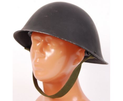 An original post-WWII Second World War issue British Infantry helmet. Mk III c1953 pattern Turtle helmet in black, with origi