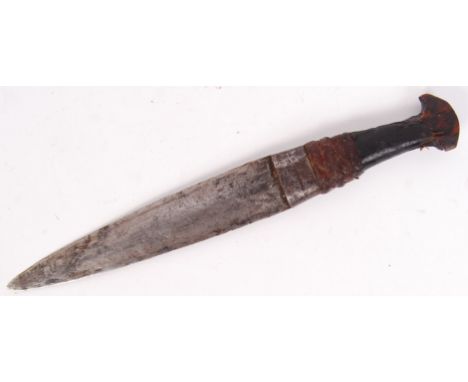 An unusual 19th century African tribal Zulu child's small hunting/ fighting dagger. With wooden handle bound to blade with le