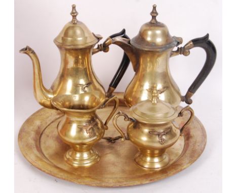 An early 20th century brass (likely once silver plated) tea / coffee service, comprising of tea pot, coffee pot, milk jug, su