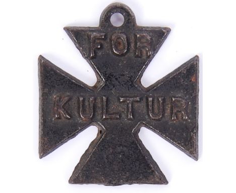 An original WWI First World War period propaganda ' For Kultur ' iron cross medal. Raised notation to front, crude cast iron 