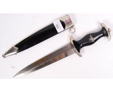 A WWII Second World War type German Third Reich Nazi SS Officers dress dagger. With eagle motif inset to handle, and etched m