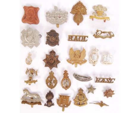 A collection of 25x First/ Second World War military cap badges to include; RAOC, Royal Ordinance Factories, S Lancashire, RA