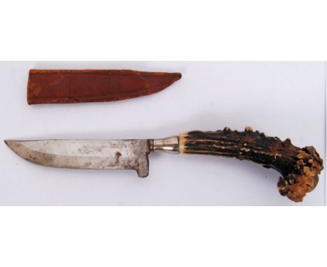 An unusual 20th century horn handled hunting/ bowie knife. No markings present. In original leather scabbard. 22cm long.  