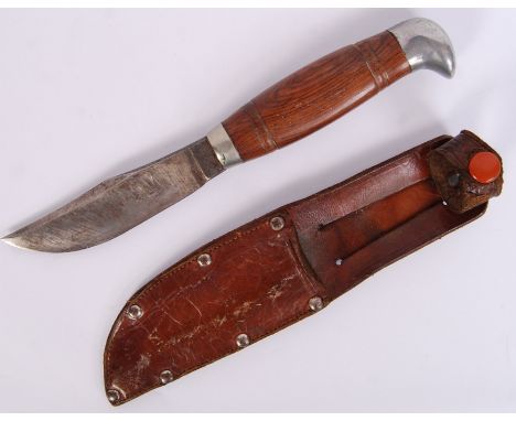 An original 20th century Bowie hunting knife within brown leather sheaf. 'I.O & Co Ltd' slightly viable to top of blade. Meas