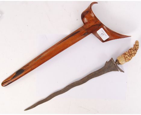 An unusual believed West African / Polynesian tribal / ceremonial Kris dagger. Waved shaped blade, with carved bone / nut han