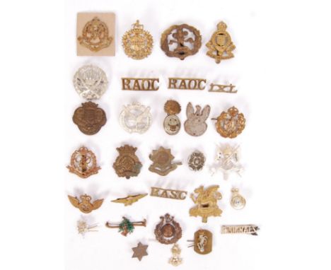A collection of 30x First/ Second World War military cap badges to include; RAOC, RASC, Military Police, R Signals, SSR, Army