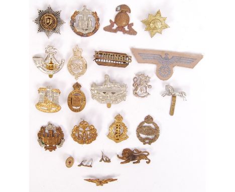 A collection of 20x First/ Second World War military cap badges to include; On War Service, RAF, The Essex Reg, Medical Corps