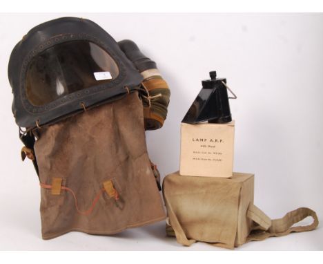 A collection of 3x WWII Second World War Home Front items. Comprising of a Babies gas mask (complete with Government plaque t