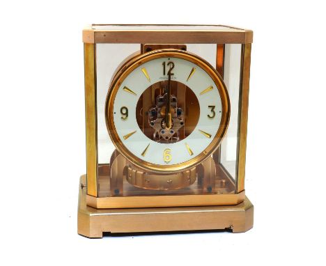 A Jaeger LeCoultre 'Classic' Atmos clock,No. 52537, with a white dial, Arabic numerals within a gilt case, complete with the 