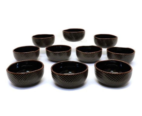 A collection of ten Japanese porcelain bowls,20th century, the exterior with ribbed diagonal decoration, stamp marked Makusan