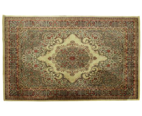 A large Persian carpet20th century, with a garden pattern to a green ground,368.5cm x 277cmCondition ReportStains to the back