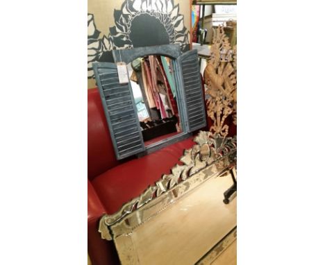 Wooden frame and louvred shutters, French style, concealing mirror. Overall measures 71 cm high, 50 cm wide *This lot will ha