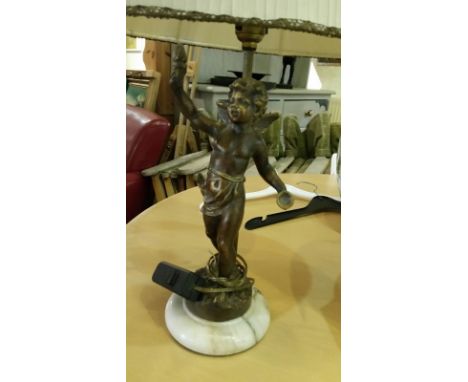 Heavy lamp base in the form of a cherub, cast metal, possibly brass coated. PAT tested. With shade. Overall 50cm high, 27cm t