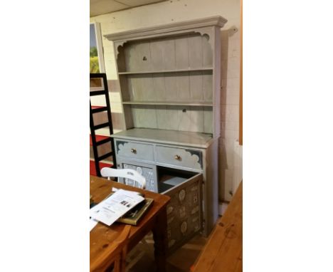Painted dresser in pale grey with cupboard fronts finished in a vintage fabric and wire. Heart cut-outs to back of top part (