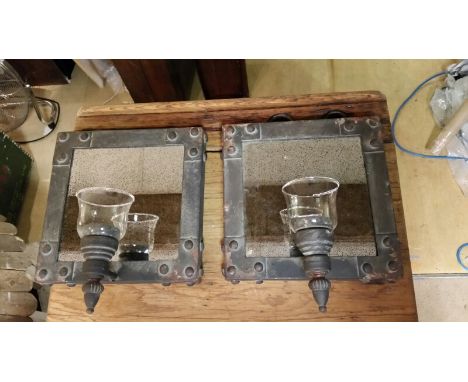 Pair of metal framed industrial style candle holders with aged mirror to back and glass candle receptacle for tea lights. For
