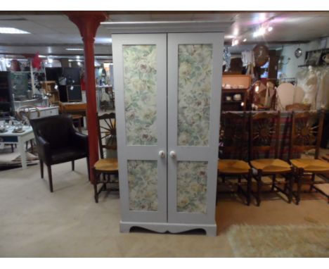 *Shabby chic single wardrobe. Floral fabric applique to panels. Doors open to reveal 2 internal shelves. Ceramic handles to d
