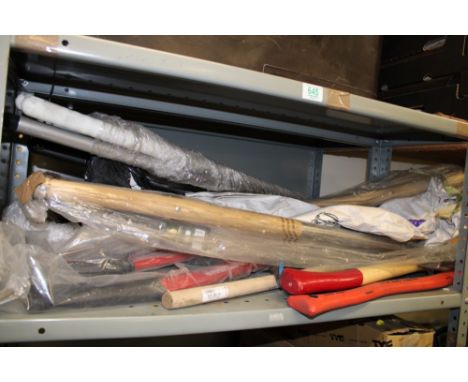 A quantity of hand tools: axes, rakes, brushes etc. 