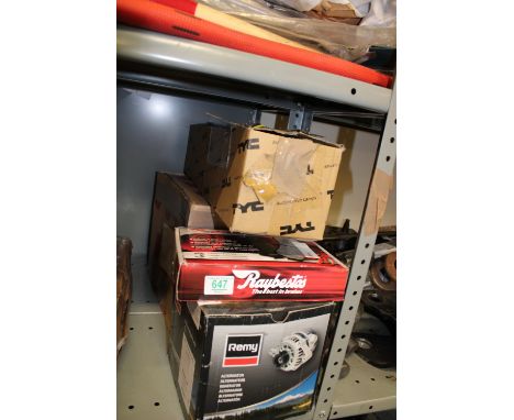 A collection of automotive items: brake pads, alternator, light etc. 