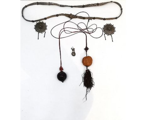 A collection of oriental items, a carved walnut netsuke, a carved black and red lacquer bead with enamel floral detailing, a 