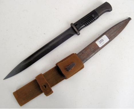 An original K-98 rifle bayonet, with original scabbard and original canvas frog. Approx 41cm long.  POSTAGE: Worldwide postag