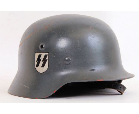 A believed original but restored WWII Second World War Third Reich SS Infantry uniform helmet. Reproduction decals to one sid
