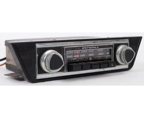 An original vintage early Motorola 010 in car radio. Twin shaped knobs to the front panel, with tuner bar to centre. POSTAGE: