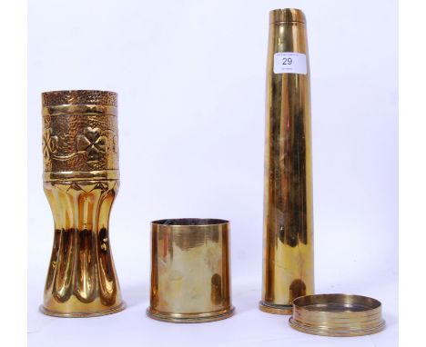 A collection of 4x trench art related military shells - each dated (1905, 1915 and 1910. The tallest being 32cm tall. POSTAGE