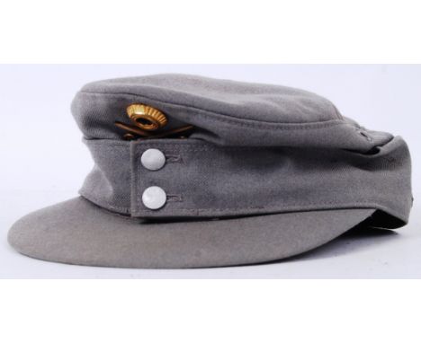 An original WWII era Second World War Third Reich Nazi officers uniform peaked cap, with Eidelweiss emblem. German markings t