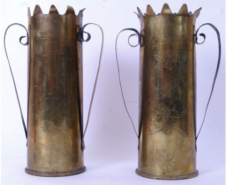 A pair of WWII Second World War Trench art style shells. Each with decorative brass handles and engraving for 'Liberation' an