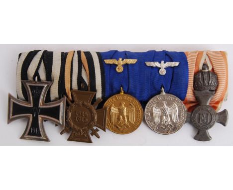 An interesting original German WWI &amp; WWII Medal group, on bar. Comprising of; First World War Iron Cross, Hindenburg Hono